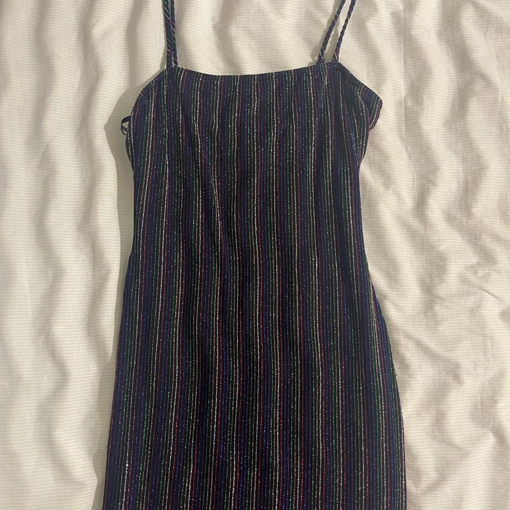 Black dress with multicolored sparkling lines.